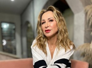 Older blonde woman with shoulder-length wavy hair